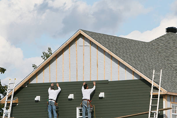 Professional Storm Damage Siding Repair technician working in Patchogue, NY